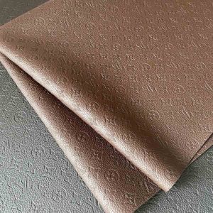 Louis Vuitton embossed brown leather fabric