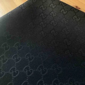 black gucci canvas fabric with bigger patterns