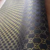 unique black gucci canvas fabric with glittered gold shiny patterns