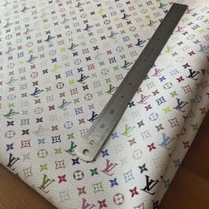 lous vuitton white leather material with multicolored monogram canvas pattern