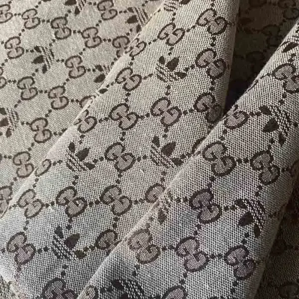 Adidas and Gucci collabration fabric which includes both brands logo