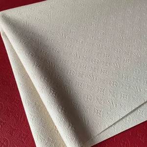 louis vuitton dirty white leather fabric used for empreinte bags: hot press pattern