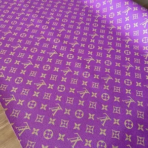 lois vuitton purple faux leather fabric material with gold monogram canvas pattern print