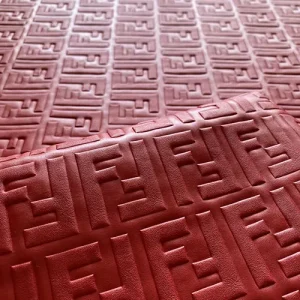 red fendi leather fabric with embossed ff pattern