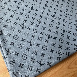 Louis vuitton gray leather fabric which has black LV pattern on it