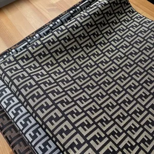 fendi fabric with black background and brown ff letters