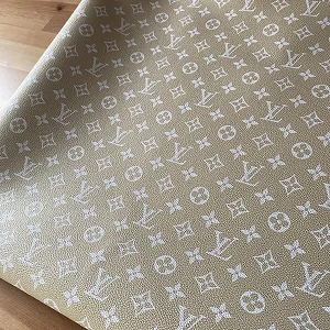 ivory louis vuitton fabric with white LV patterns