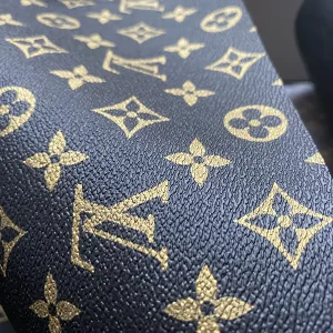 black lv fabric with gold pattern