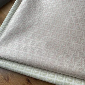 white fendi jacquard fabric for sale by the yard with ivory FF patterns on it