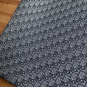 Dark Gray Dior Fabric with black pattern and light gray contour lines