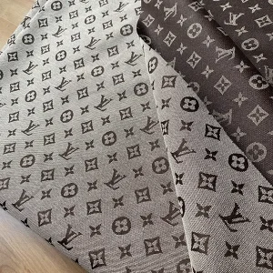 brown lv jacquard fabric with black monogram on